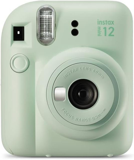 Instax Mini 12 sage green camera front view showing lens and flash