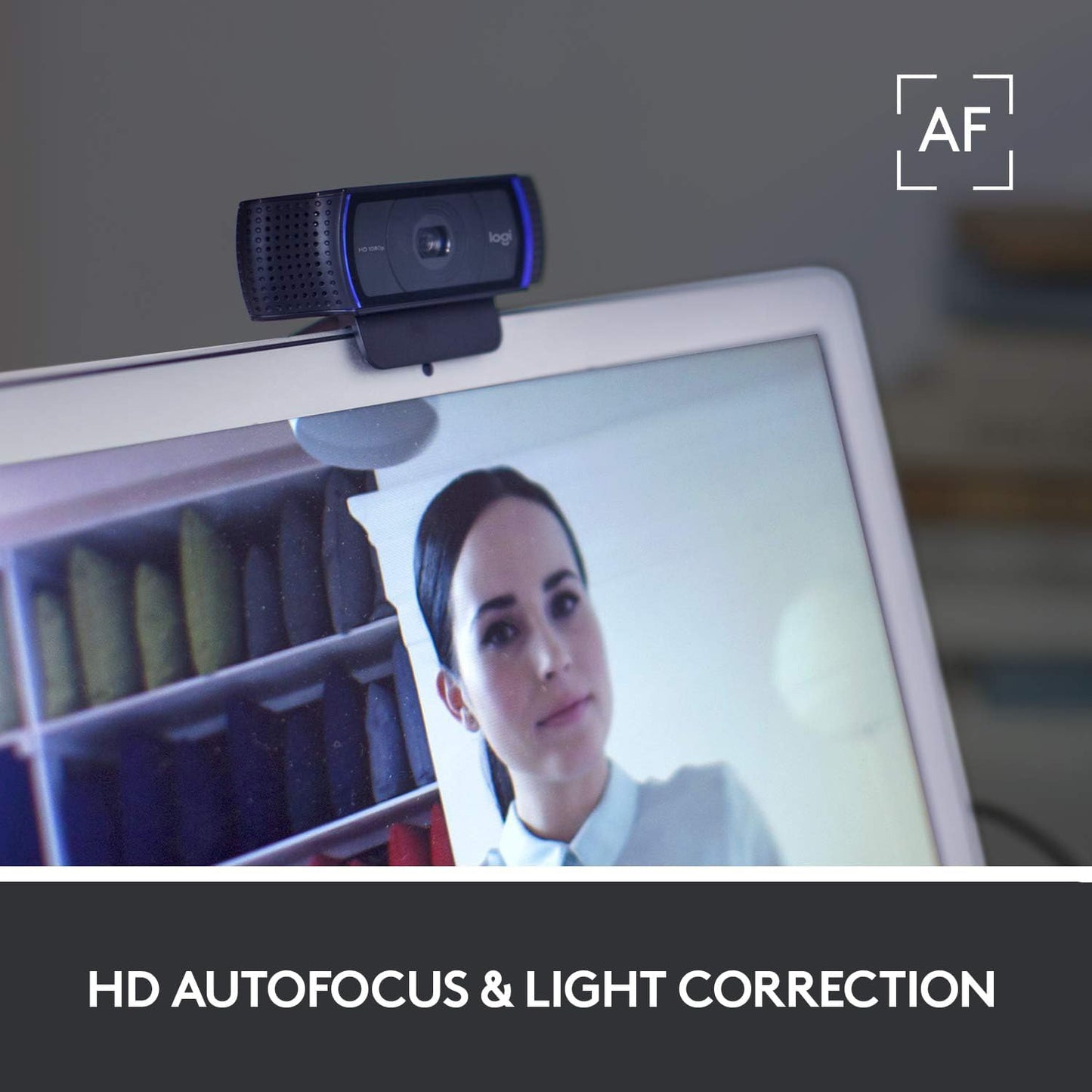 Logitech C920 webcam clipped onto laptop screen for video calls